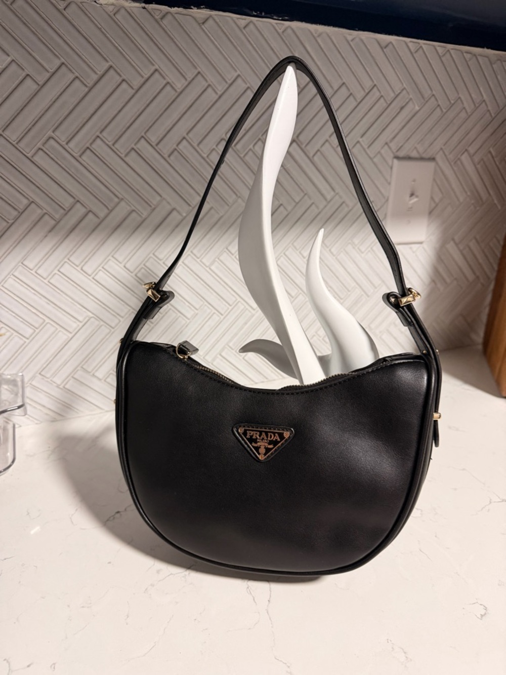 Prada Black Leather Crescent Shoulder Bag with Gold-Tone Logo